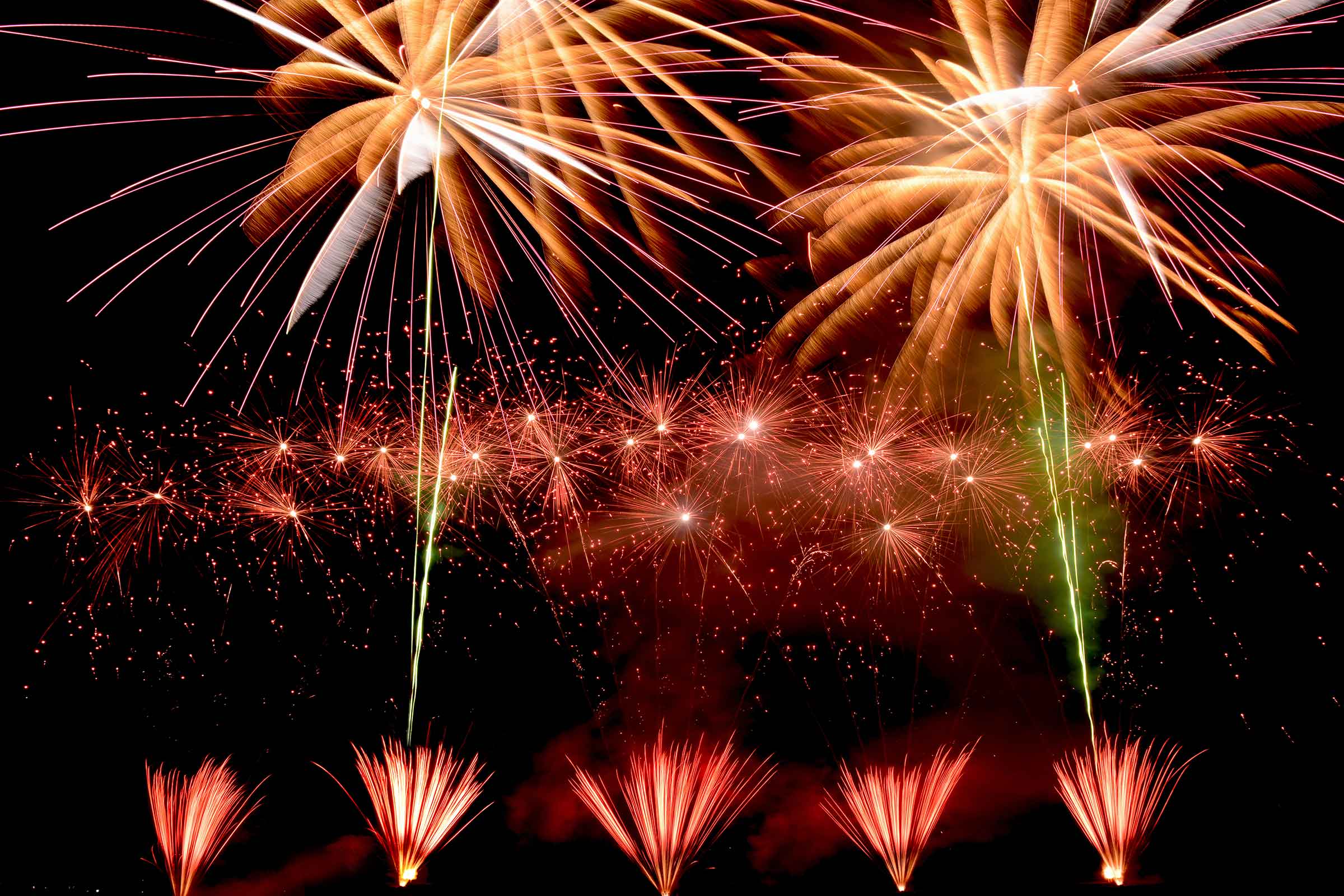 Large-scale private pyromusical display lighting up the night sky